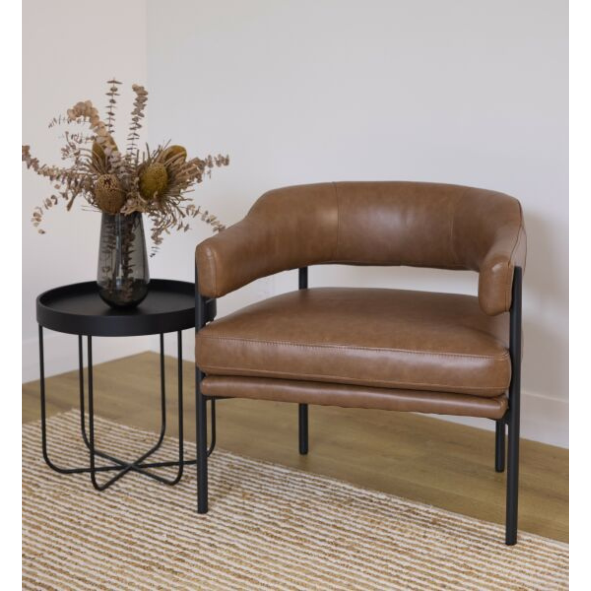 Stylish occasional chair with rounded backrest in Tan leather