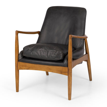 Black leather armchair with polished timber arms and legs